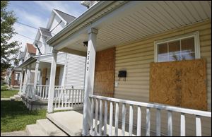 Vacant homes in the 2200 block of Kent Street in Toledo are just a few of the homes developed as tax credit properties.