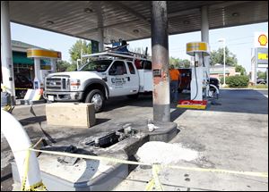 Police say the accident at the True North Shell station on West Central occurred when a woman asked her 11-year-old niece to move the car closer to the pump.