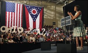 First Lady Michelle Obama speaks at Westerville Central High School near Columbus. She said Tuesday that her husband understands struggles and has the back of the middle class.