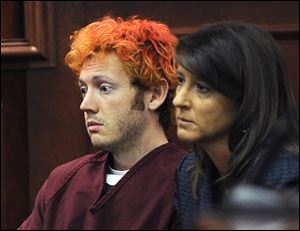 Defendant James Holmes appears in Arapahoe County District Court. He didn't speak a word and at one point, closed his eyes.