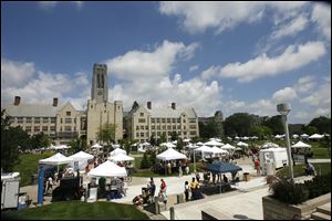 Artists and patrons swarm Centennial Mall during a recent Art on the Mall at the University of Toledo.