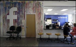 This photo shows workers at the Facebook office in Menlo Park, Calif. 