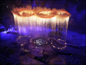 The Olympic rings light up the stadium during the Opening Ceremony at the 2012 Summer Olympics, Friday, in London.