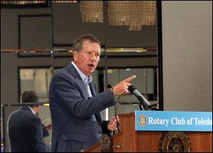 Gov. John Kasich speaks to members of the  Rotary Club Of Toledo during their meeting at the Park Inn Hotel.