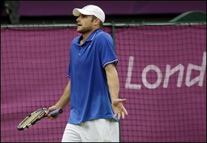 American Andy Roddick gestures to his team during his two-set loss against Novak Djokovic of Serbia during their match on Tuesday.