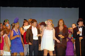 From left, Larissa Barman as Susan Stuyvestant Fish, Ben Davies as Buck Wayne, Megan Wax as Polly Pepper, Allie Dembicki as Mrs. Granville, Ryan Book as the Duke, and the cast of ‘Flapper.’