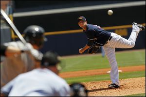 Toledo's Drew Smyly delivers a pitch to Louisville's Chris Valaika. Smyly allowed two hits in three scoreless innings, striking out five.