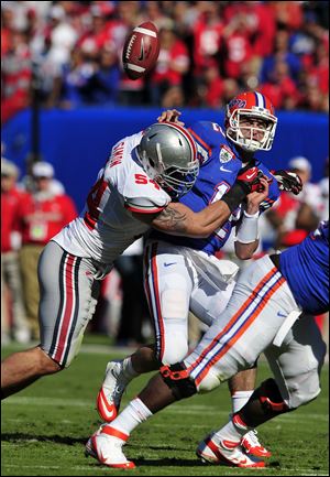 Defensive end John Simon, left, making a tackle in the Gator Bowl, has been called by his coach 'as good as any player in college football.'