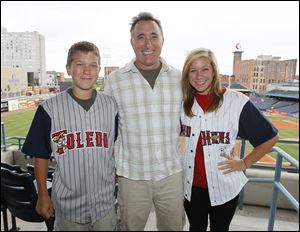 Allan Funkhouser, Tiffin, and his children Mathew, 14, and Emily, 19, rented a party suite at Fifth Third Field on Aug. 11, when the Toledo Mud Hens played the Durham Bulls.