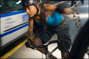 Dania Ramirez plays Vanessa in a scene from 'Premium Rush.'