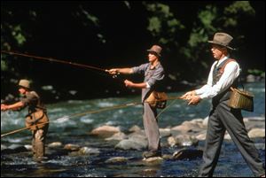 Actors Brad Pitt, from left, Craig Sheffer, and Tom Skeritt fish in a scene from 