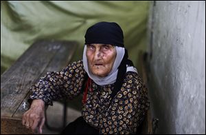 Fatimah Ali fled her home in Aleppo with her family and took refuge in a school in Suran, Syria. Thousands of displaced Syrians are struggling to find safe shelter.