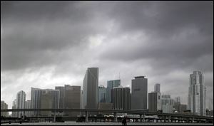 Storm clouds hang over Miami. Residents of southeast Florida were urged to stay home Sunday.