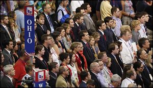 Delegates from the state of Ohio listen to Reince Priebus, chairman of the Republican National Committee, during the abbreviated opening session of the Republican National Convention in Tampa, Fla., on Monday.