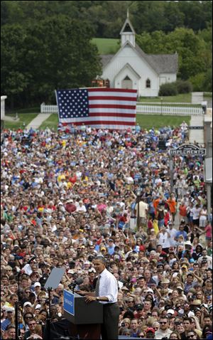 Crowds fill the streets as President Obama speaks at Urbandale, Iowa, during a campaign stop Saturday.