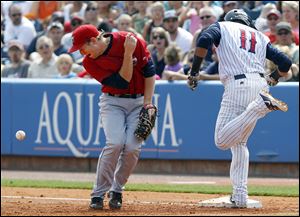 Toledo's Argenis Diaz, right, reaches first base safely as Columbus' Jared Goedert mishandles the throw. The Mud Hens lost 4-3.