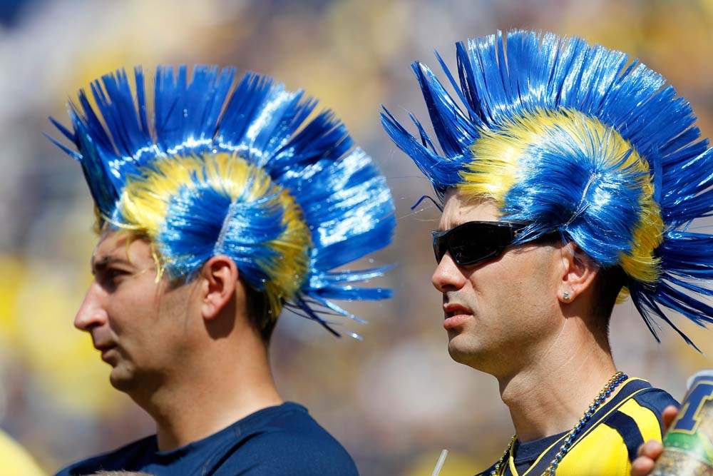 Fans-soak-up-the-sun-as-the-University-of-Michigan