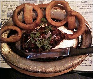 Top sirloin with onion rings. 