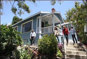 Potential buyers tour a home for sale in the Highland Park neighborhood of Los Angeles, California.