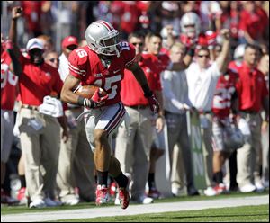 Ohio State's Devin Smith escapes from the California defense to score the winning touchdown.
