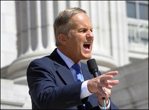 Todd Akin speaks at the Missouri Women Standing with Akin Rally on the south side steps of the Missouri Capitol on Friday.