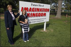 Imagination Kingdom coordinators Gloria Gunn, left, and Bonnie Grisier, with grandson Carter Nisely, have received community support to build the playground on the south side of Reighard Park.