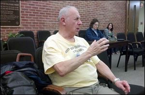 Gil Lutz, of Perrysburg, addresses the city's Health, Sanitation and Public Utilities Committee at its meeting Tuesday in council chambers on what he called 