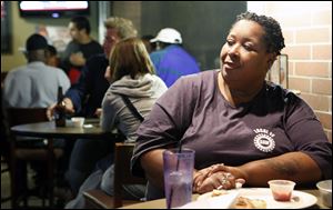 Winene Matthews of Toledo watches the presidential debate.