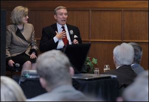 Guest speakers Barbara and John Cochran, a former ABC News reporter, answer questions about journalism and politics from the audience Wednesday at the Toledo Club.