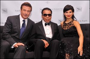 Actor Alec Baldwin, former boxing champion Muhammad Ali and Hilaria Thomas Baldwin at Thursday's benefit.