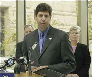 U.S. attorney Steven M. Dettlebach. Behind at left is Wood County prosecutor Paul Dobson, and at right is Robin Shoemaker, Special Agent in Charge, ATF Columbus Field Division. 