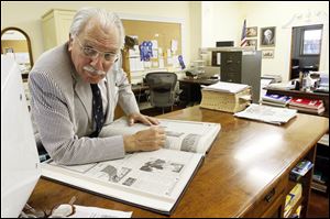 Ross Taylor, the Publisher/Editor of the Archbold Buckeye works in the newsroom of the newspaper.