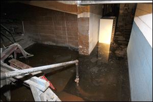 Floodwater fills the basement of the Nicholas Building, the former Fifth Third Center, at Madison and Huron.