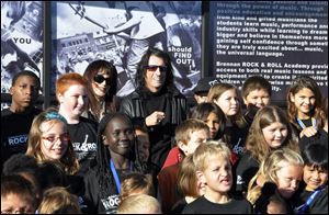 Heavy metal icon Alice Cooper, rear center right, helped open a 6,000-square-foot rock 'n' roll academy that will be open exclusively to club members.