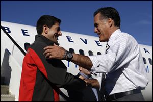 Republican presidential candidate Mitt Romney greets his vice presidential running mate, Rep. Paul Ryan, R-Wis., at Port Columbus International Airport.