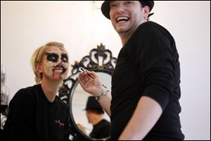 Carl Graf, a professional makeup artist, reacts to the transformation of Mary Beth Lengel.