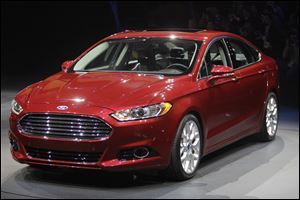 The 2013 Ford Fusion, pictured, and the 2012 Toyota Camry hybrid are two of the six models that will be jockeying for a share of the midsize-sedan market. Families had left behind the sedan for the sport utility vehicle and the minivan, but are returning because of high-tech styling and better gas mileage.