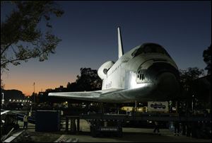 The space shuttle Endeavour is moved to the hangar in the California Science Center for its last stop on Sunday, in Los Angeles. Endeavour arrived at the museum after a 12-mile parade with thousands of onlookers ending with a greeting party of city leaders and other dignitaries.