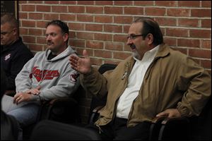 Restaurant owner Jim Hodulik, right, was at at Perrysburg City Council meeting Tuesday where the council agreed to let Hodulik extend his restaurant's patio on to the sidewalk.