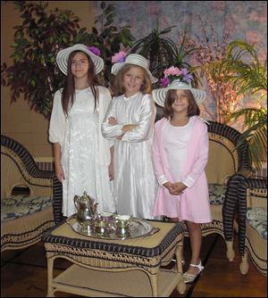 Shaylin, Shannyn, and Shanara Jenkins are dressed for the Tea and Hat affair.