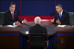 Republican presidential nominee Mitt Romney and President Barack Obama answer a question during the third presidential debate at Lynn University.