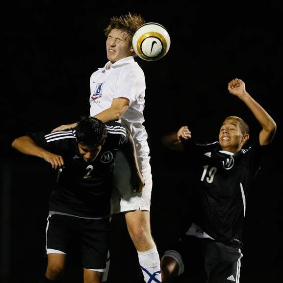 District-Boys-soccer-leaping