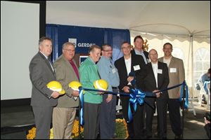 From left, Monroe City Mayor Robert Clark, State Representative Dale Zorn, Congressman Tim Walberg, UAW Local 723 Chairman Jeff Morris, Gerdau Special Steel North American (GSN) President Jack Finlayson, GSN VP of Operations John Kelleher, Executive Director of Gerdau Special Steel (Global) Mark Marcucci, GSN Monroe mill General Manager Otto Alvarado at the ribbon cutting ceremony, at the Gerdau Company.   