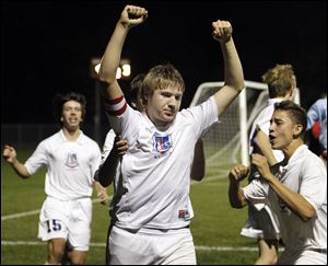 St. Francis' Kevin Olszewski celebrates after scoring the game winning penalty kick in triple overtime Wednesday against Sylvania Northview during a Division I boys district soccer semifinal. St. Francis defeated Northview 4-3 in triple overtime.