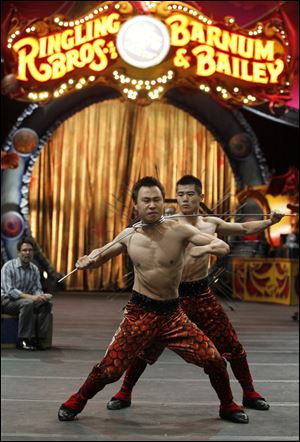 Sun, left, and Qin, right, of the Kung Fu Kings, perform during Friday’s show.