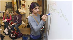 Tiana Sarsour trains with her team on public forum debates during practice at Northview High School. The team of about 25 students has been named to the 100 Club by the National Forensic League.