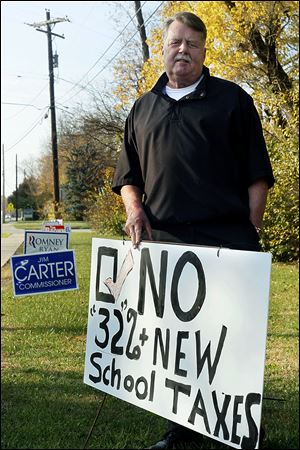 Perrysburg resident Phil Caron opposes the levy, saying it is an 'unashamed request' to keep high salaries in place.