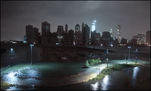 Lower Manhattan goes dark during hurricane Sandy as seen from Brooklyn, N.Y.