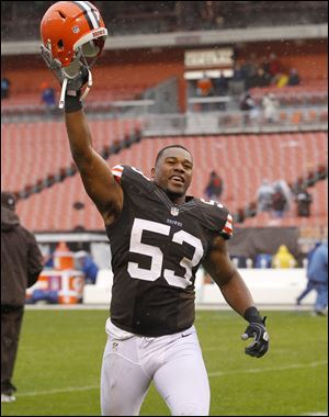 Cleveland Browns linebacker Craig Robertson celebrates after the Browns beat the San Diego Chargers in an NFL football game in Cleveland.