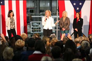 Ann Romney, wife of Republican presidential candidate Mitt Romney, speaks during a campaign stop Wednesday at Vinylmax in Hamilton, Ohio. Joining her on stage, from left, Jane Dudley Portman, wife of Ohio senator Rob Portman, Cindy McCain, wife of Arizona senator John McCain, and Ohio Lt. Gov. Mary Taylor. 